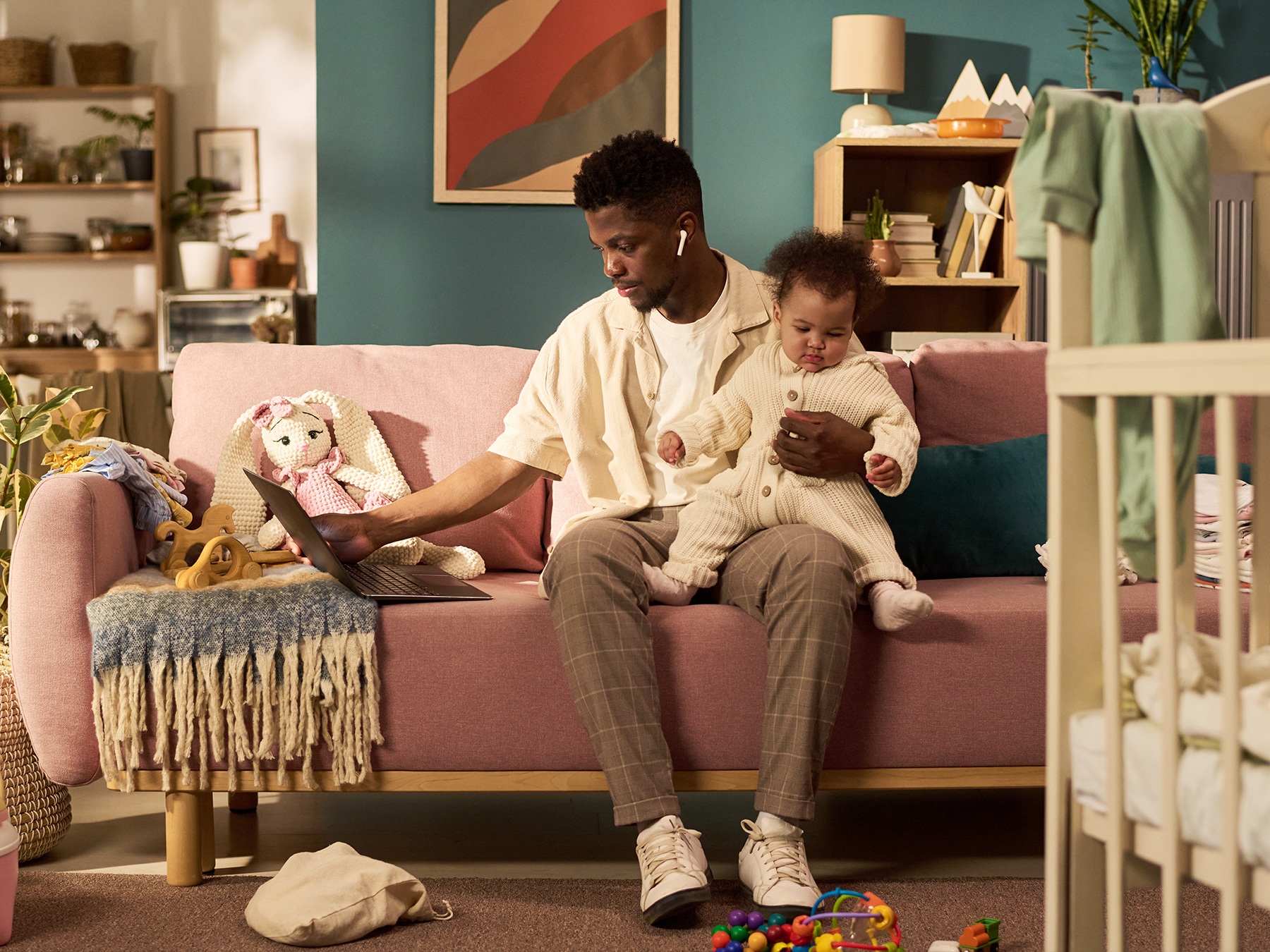 Young male professional CPA at home with child.