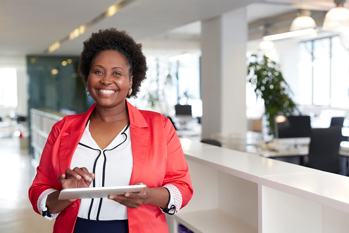 Professional female CPA in office environment on tablet