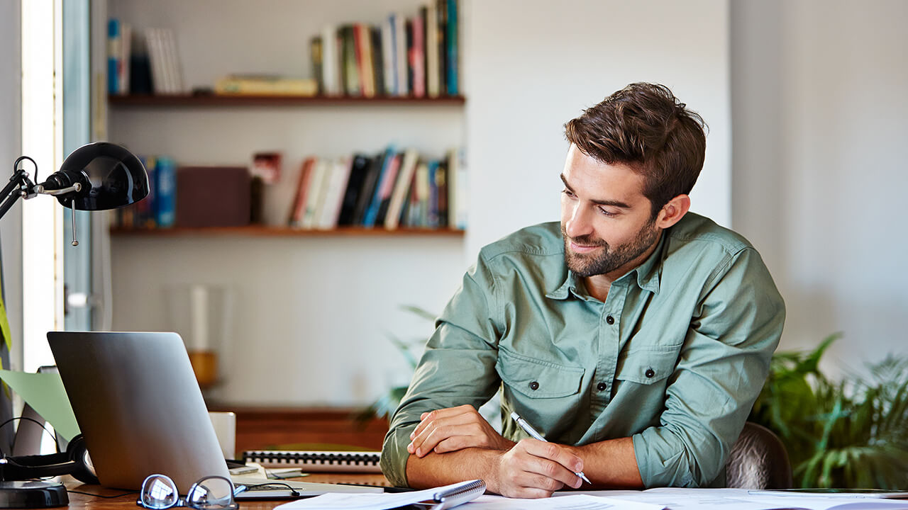 Young male professional CPA working on laptop