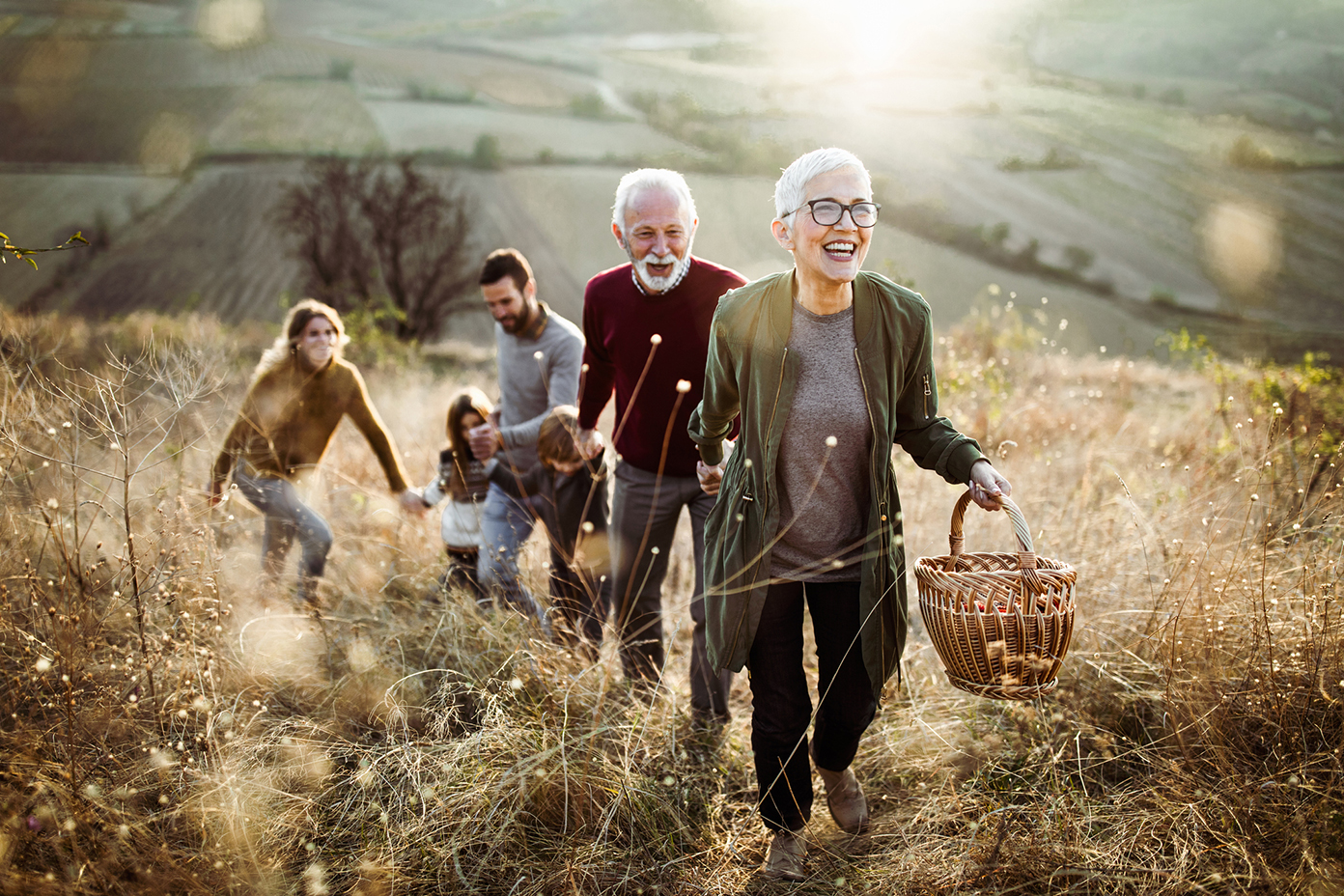 Family outside walking in a field