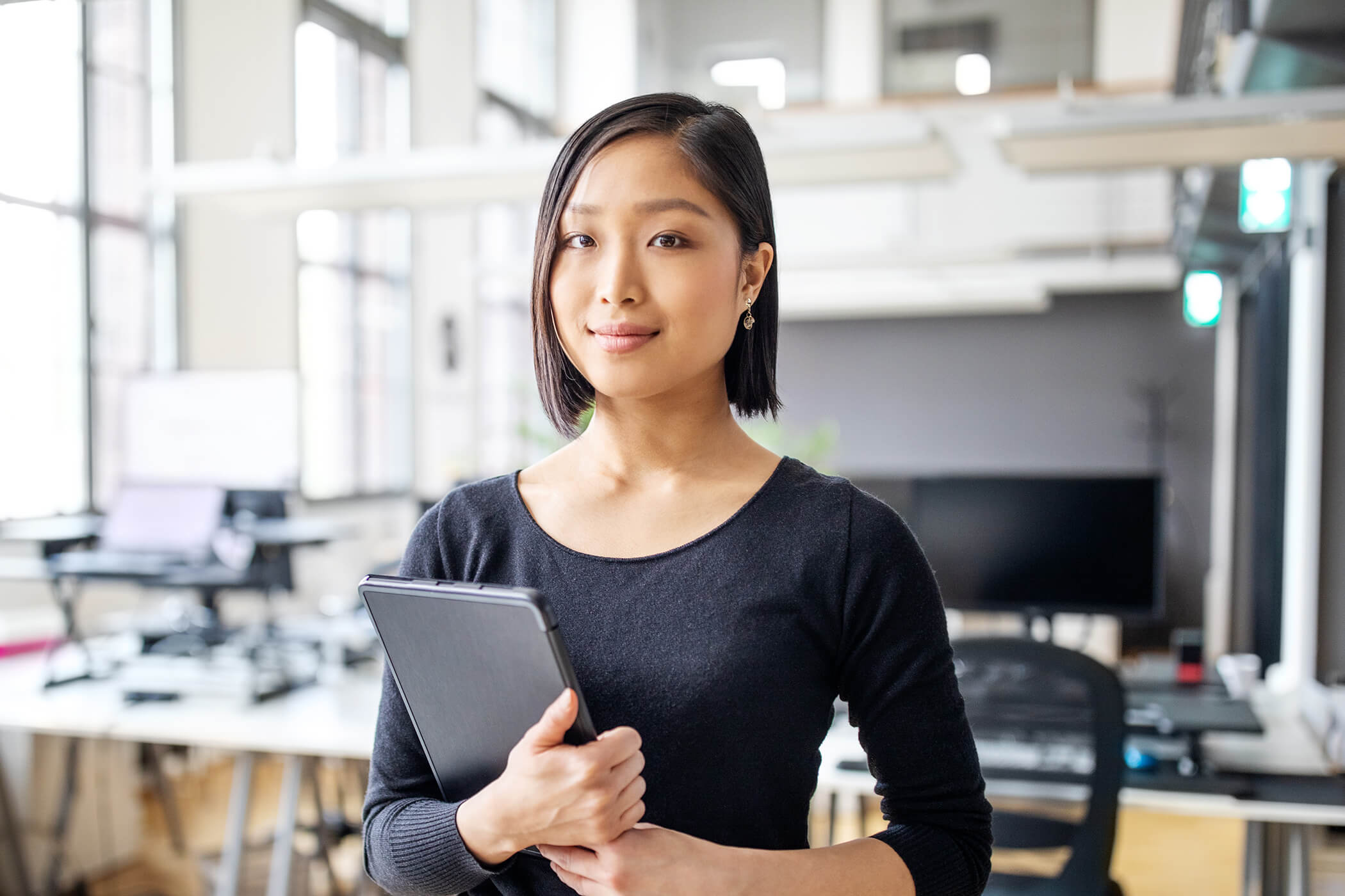 Young female professional CPA at work with tablet