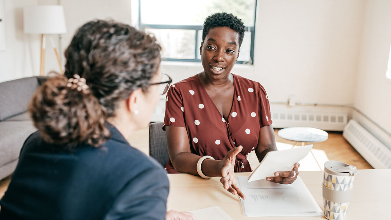 Professional female CPA meeting with her client